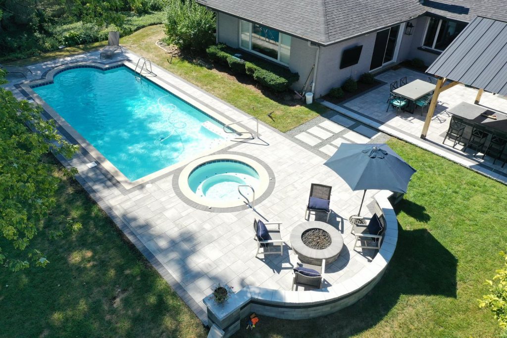 patio with pool - pavestone brick paving