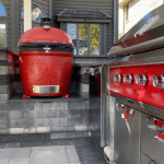 Outdoor kitchen under retractable canopy roof