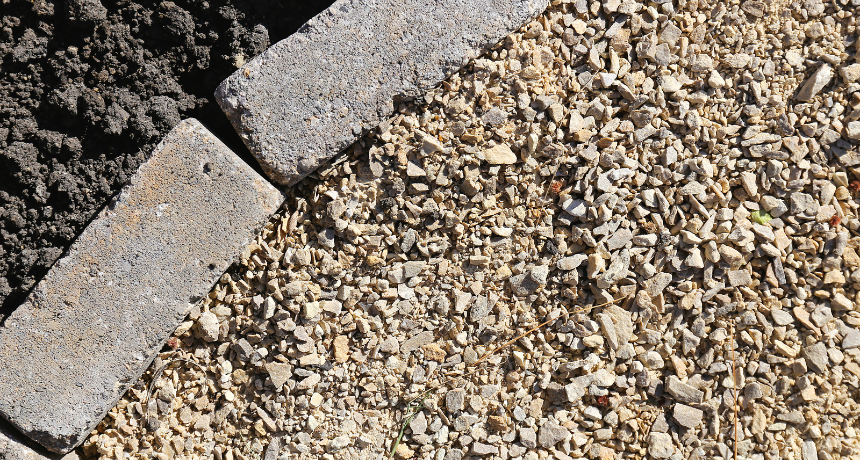 Cobblestone Pavers Edging Gravel and Garden Soil